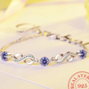 Thin 925 sterling silver infinity bracelet with beautiful coloured zirconia stones - BS